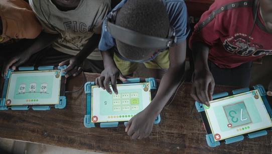 Can't Wait to Learn Uganda children on a tablet_War Child_200228