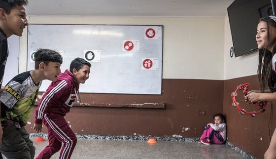 Venezuelan children having fun in Bogota_TeamUp_War Child Colombia_190315