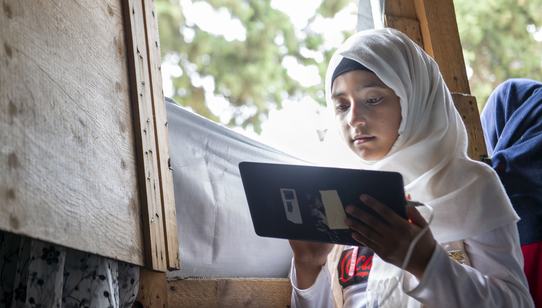 Girl Laila learns through tablet education in Lebanon_Can't Wait to Learn_War Child_200802