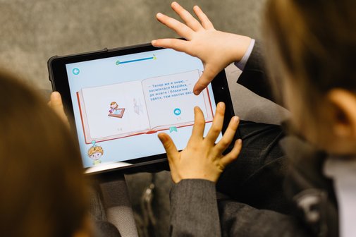 Children learning on a tablet